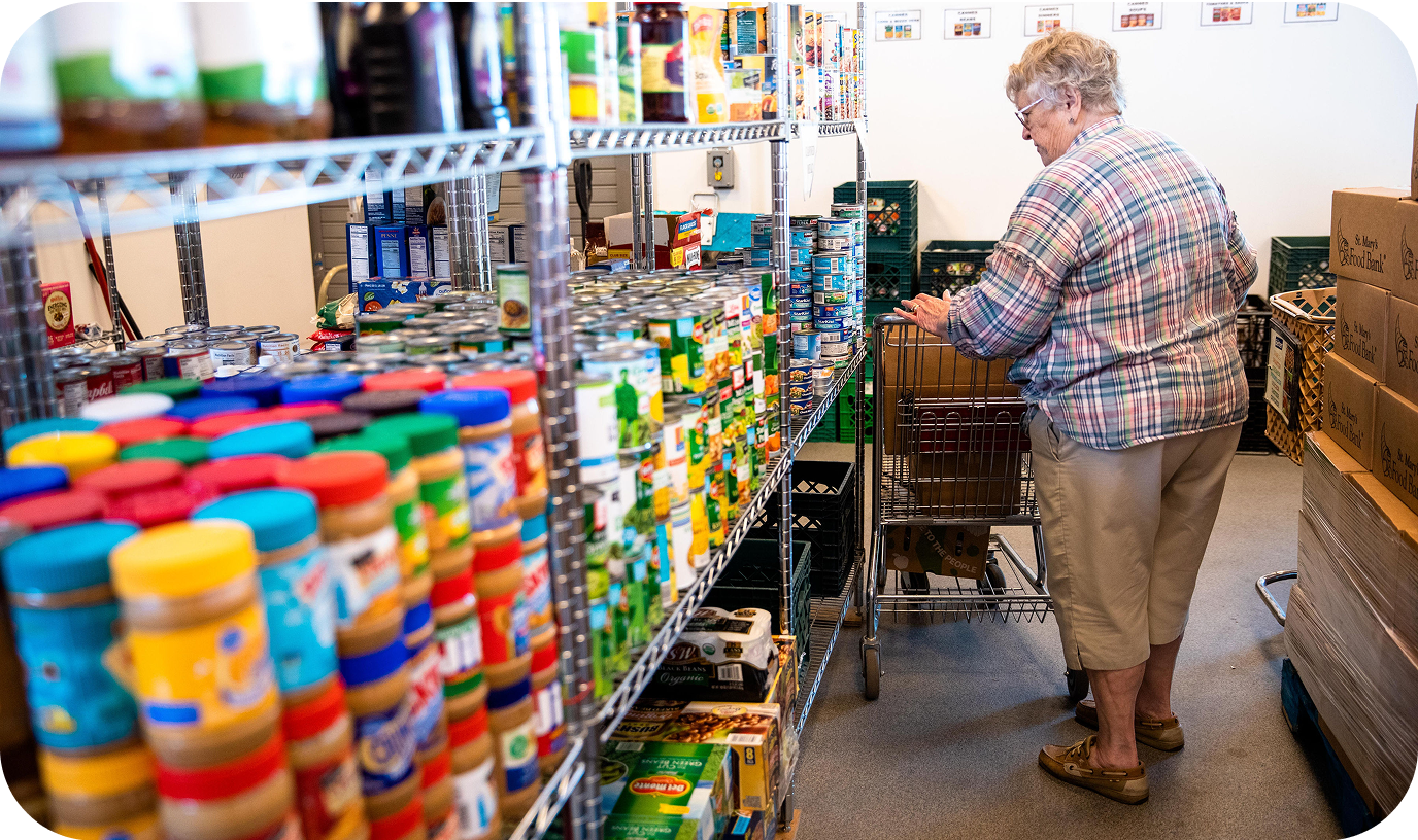 A woman taking count of items in a pantry