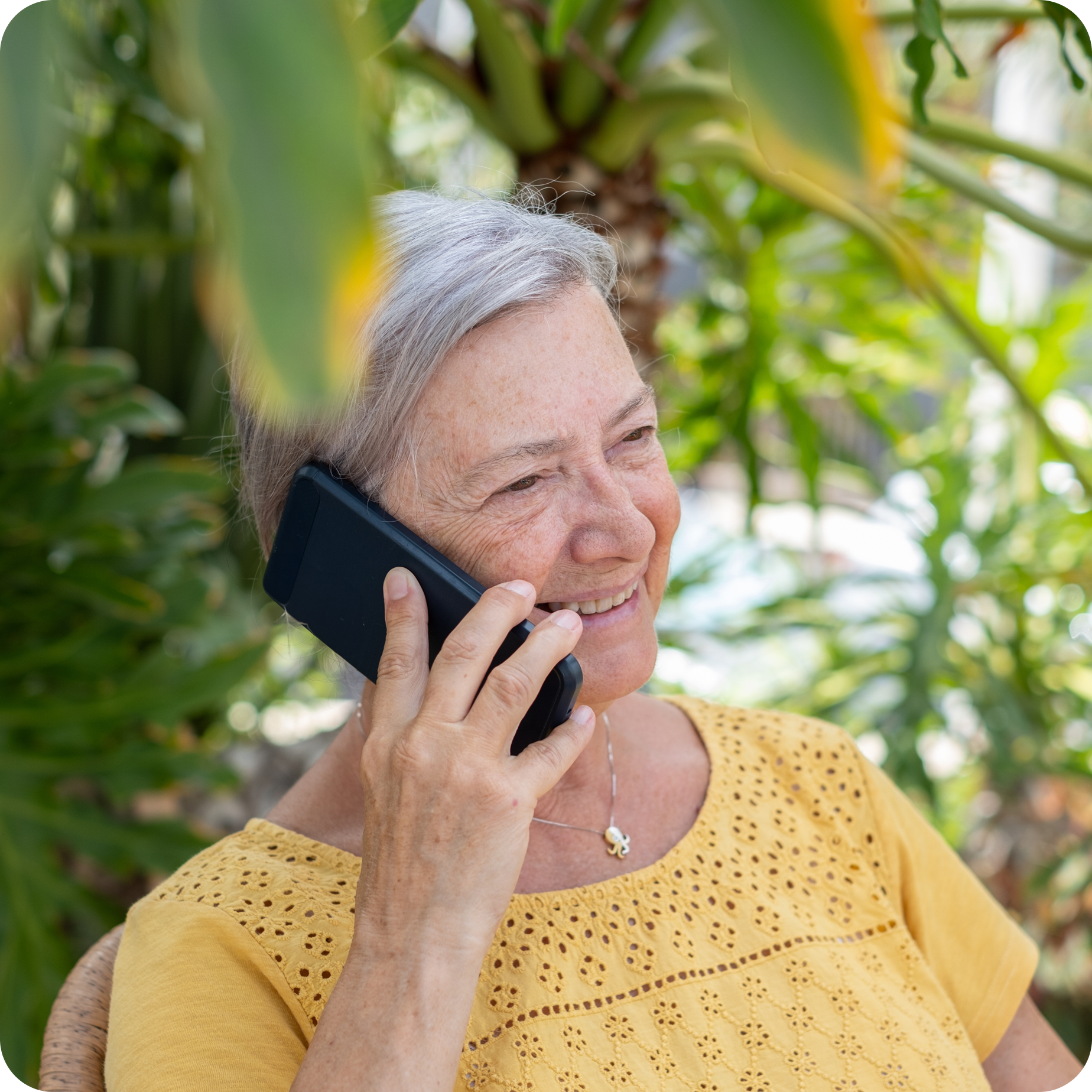 A senior woman making a phone call
